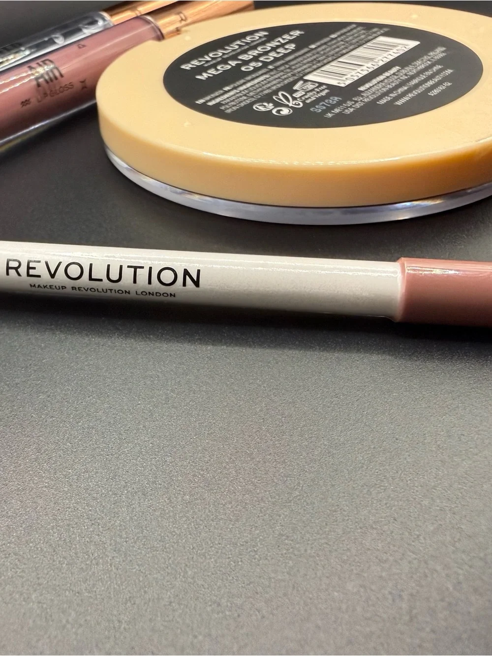 Revolution Makeup bundle- Bronzer in Deep, 2 lip glosses,  lip liner in Mauve